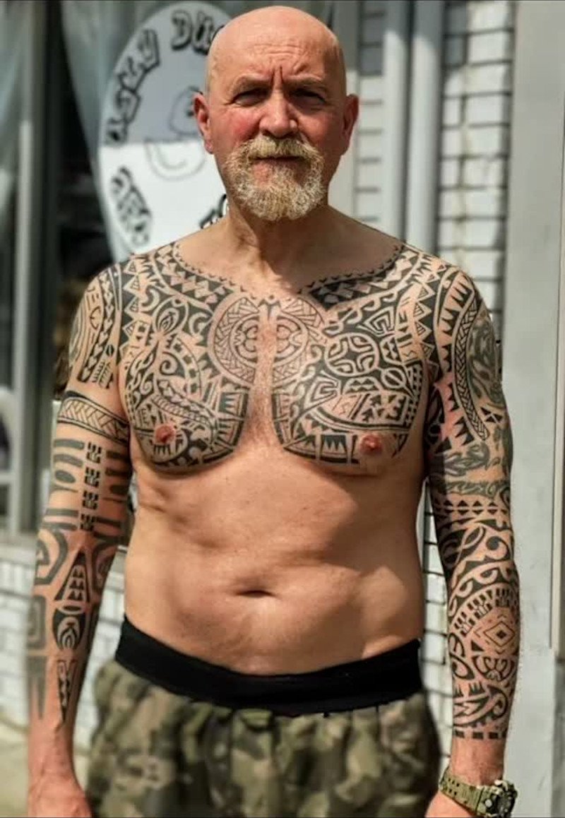 Polynesian tattoo piece on pecs and arm sleeves: inked placement real user tattoo photo