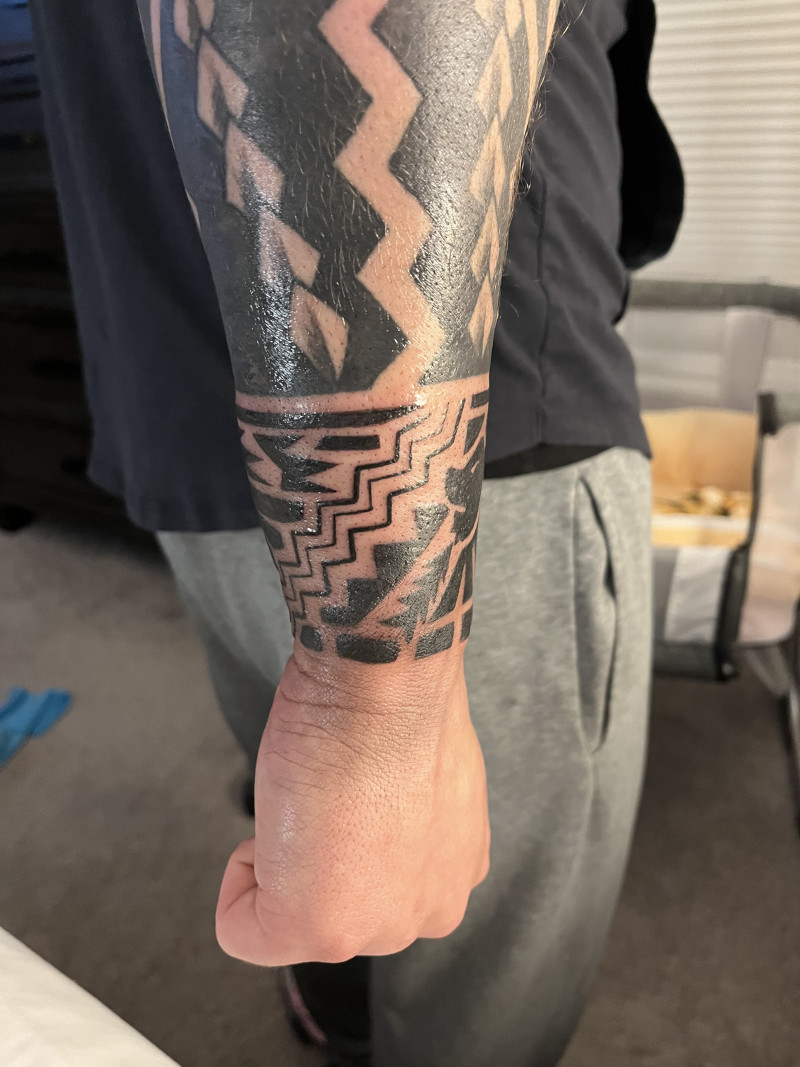 Marquesan inspired armband tattoo with eagle and lion: inked placement real user tattoo photo