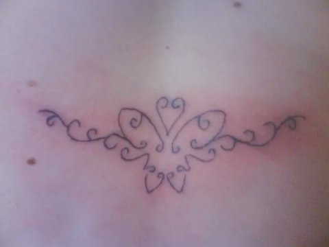 Yvonne - Butterfly lowerback: real inked placement tattoo photo thumbnail