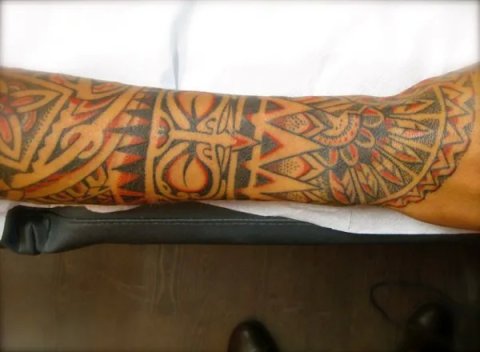 Tanne colour Polynesian: real inked placement tattoo photo thumbnail