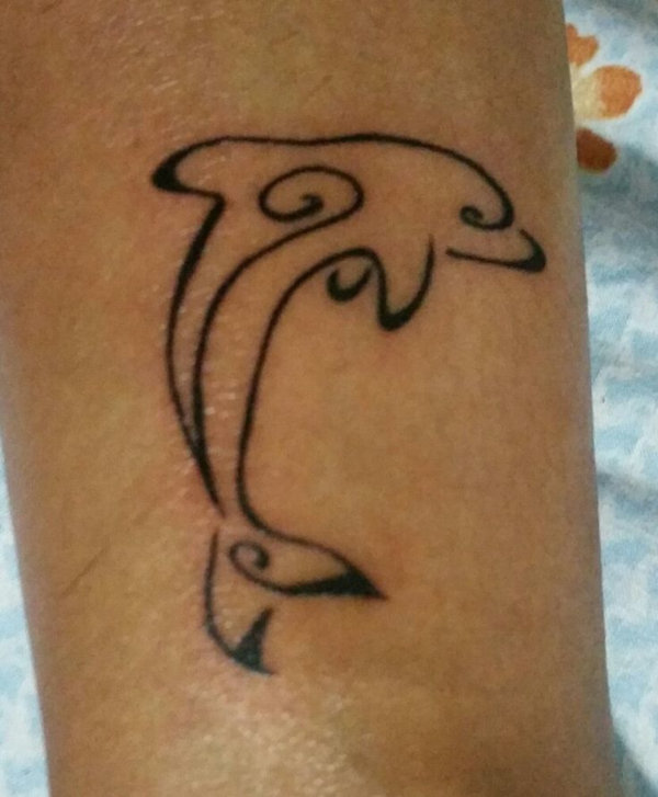 Enna  - stylized dolphin tattoo photo